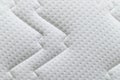 Closeup of white mattress texture background. Material and furniture concept. Comfortable soft couch bedding
