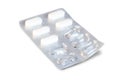 Closeup of white medicine pills in a partly used blister pack Royalty Free Stock Photo