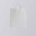 Closeup White Paper Bag Isolated Center Gray Empty Background.Mockup Highly Detailed Texture Materials.Space for