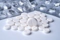 Closeup of white pills and empty packaging from drugs on a white background with texture Royalty Free Stock Photo