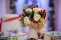 Closeup of white roses wedding bouquet at reception Royalty Free Stock Photo