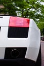 Closeup of a white super car parked in the street