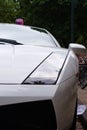 Closeup of a white super car parked in the street