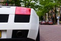 Closeup of a white super car parked in the street