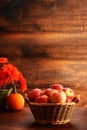 Closeup wicker basket with gala apples and pumpkin