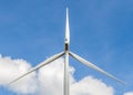 Closeup of wind turbine producing alternative energy in wind farm Royalty Free Stock Photo