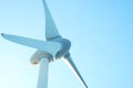 Closeup wind turbines, wind power blue sky background, design architecture