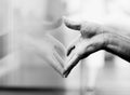 Closeup, window and hand with a reflection, glass and grey with monochrome and aesthetic. Zoom, person and model with