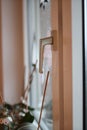 Closeup of a window knob under the lights with a blurry background