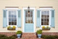 closeup of windows with shutters on brick cape cod house Royalty Free Stock Photo
