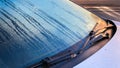 Closeup of windshield wiper covered rain drop in the morning Royalty Free Stock Photo