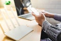 closeup of a wireless router and a man using smartphone on living room at home ofiice Royalty Free Stock Photo