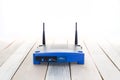 Closeup of a wireless router wifi on wood floor Royalty Free Stock Photo