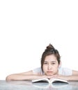 Closeup asian woman with boring face with a book on marble table in front of house isolated on white background with copy space