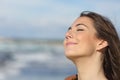 Closeup of a woman breathing fresh air on the beach Royalty Free Stock Photo