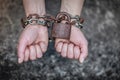 Closeup woman with chained hands and padlock