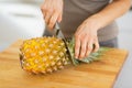 Closeup on woman cutting pineapple Royalty Free Stock Photo