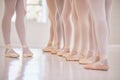 Closeup woman dance instructor teaching a ballet class to a group of a children in her studio. Ballerina teacher working Royalty Free Stock Photo