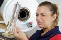 closeup woman disgusted by limescale