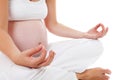 Closeup of woman doing meditative pregnancy yoga Royalty Free Stock Photo