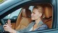 Closeup woman driver beeping in car. Woman standing in traffic jam in automobile Royalty Free Stock Photo