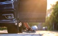 Closeup of woman driver legs getting out of her car. Transportation and traffic concept Royalty Free Stock Photo