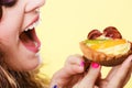 Closeup woman eating fruit cake sweet food Royalty Free Stock Photo