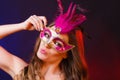 Closeup woman face with carnival mask on dark