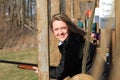 Closeup woman with gun at trap shooting range