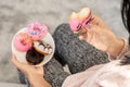 Woman hand eating donuts , sugar addiction concept , unhealthy eating sweet food Royalty Free Stock Photo
