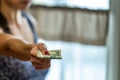 Closeup of woman hand giving money Royalty Free Stock Photo