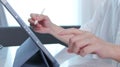 Closeup of woman hand hold electronic pen and writing on digital tablet for searching on web page, technology, website, Business Royalty Free Stock Photo