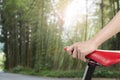 Closeup on woman hand holding bike seat