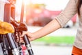 Closeup of woman hand holding a fuel pump at a station. Royalty Free Stock Photo