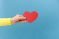 Closeup of woman hand holding red heart, cute symbol of sensual feminine romantic love, greeting card on Valentine's day, 14 Royalty Free Stock Photo