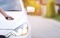 Closeup woman hand holding the remote control car alarm systems Royalty Free Stock Photo