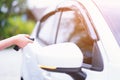 Closeup woman hand holding the remote control car alarm systems Royalty Free Stock Photo