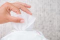 Closeup woman hand holding wet wipes from package. healthcare, p