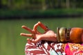 Closeup of woman hand in mudra gesture practice yoga meditation outdoor by the lake summer day Royalty Free Stock Photo