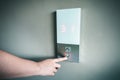 Closeup of Woman Hand is Pressing Elevator Button for Access to Office Building, Electrical Lift Buttons Control for Moving Up or Royalty Free Stock Photo