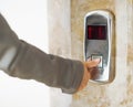 Closeup on woman hand pushing elevator button