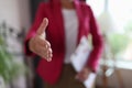 Closeup of woman hand reaching out for greeting in office Royalty Free Stock Photo