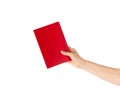 Closeup of woman hand showing red notebook, holding textbooks or organizers, education, reading literature. Indoor studio shot