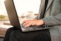 Closeup of woman hand typing on laptop keyboard