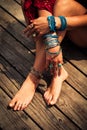 Closeup of woman hands and feet with boho summer fashion details Royalty Free Stock Photo