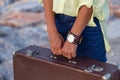 Closeup of woman hands holding vintage suitcase Royalty Free Stock Photo