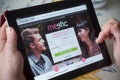 Closeup of woman hands on the meetic dating home page of web site on tablet