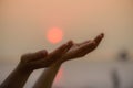 Closeup woman hands praying for blessing from god during sunset Royalty Free Stock Photo