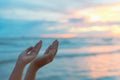 Closeup woman hands praying for blessing from god during sunset Royalty Free Stock Photo