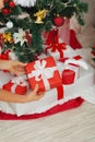 Closeup on woman hands putting Christmas present
